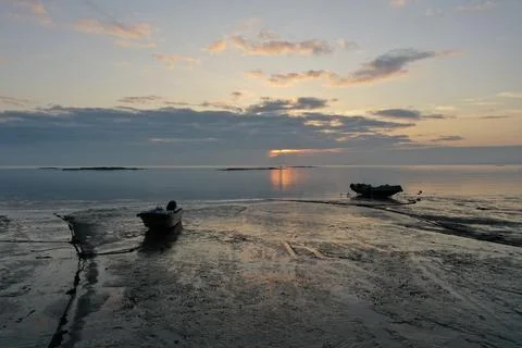 Low-Angle Boats on Tidal Mudflat at Taiwan Strait Sunrise Stock Photos