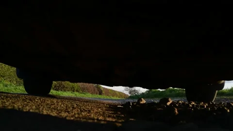 Low angle car driving over camera on country road at sunset york united kingdom Stock Footage 143402561