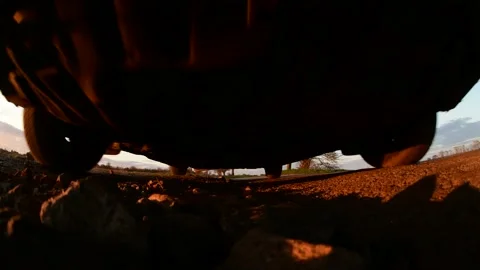 Low angle car driving over camera on country road at sunset york united kingdom Stock Footage 143407446