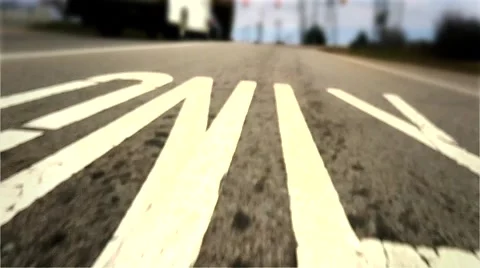 Low Angle Car POV of Painted Road Markings on Highway Exit Stock Footage 48334749