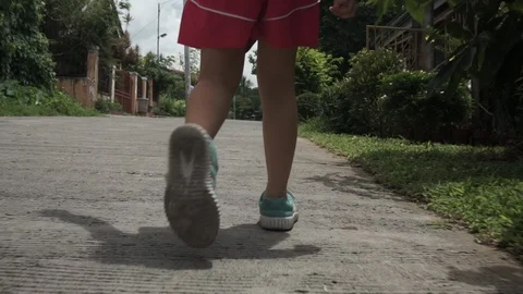 Low Angle Child Walking Along in the philippines Stock-Footage 112754677