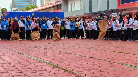 Low angle cinematic shot. The sack race competition Stock Footage 315372759