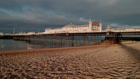Low angle clip of Brighton Pier at dawn Stock Footage 194494625