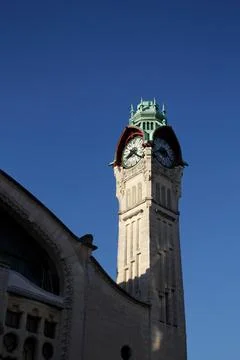 Low angle of a clock tower in a train station in Paris, France Stock Photos