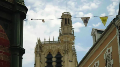 Low angle close-up of cathedral bell tower with banner, Sens, France Stock Footage 339201386
