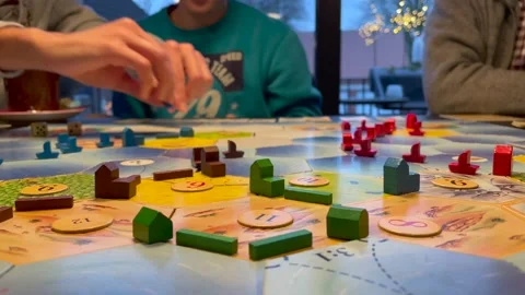 Low angle close up of disabled group playing boar game during christmas time. Video stock 145828751