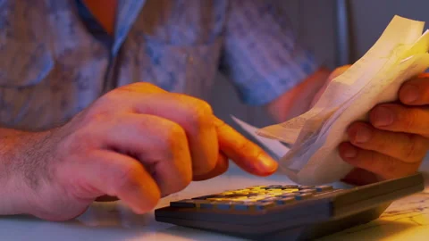 Low angle close-up of hands flipping through paper receipts Stock Footage 336982843