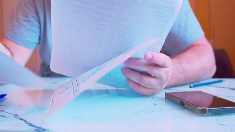 Low angle close-up of hands sorting documents and stacking them neatly Stock Footage 336693094