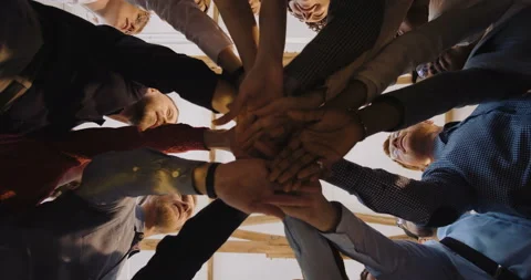 Low angle close-up, happy group of diverse business people put hands together Stock Footage 109434228