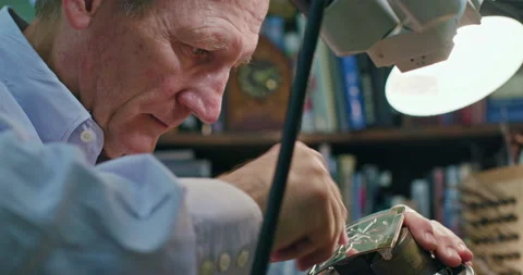 Low angle close up of a jewelry maker working on a belt buckle. Stock Footage 137268054