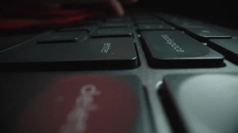Low Angle Close-Up of Keyboard in Dramatic Red Lighting Stock Footage 337996427