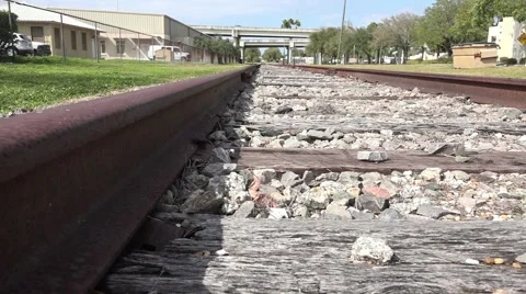 Low Angle Close Up Railroad Thru Industrial District 02 Stock Footage 47454570