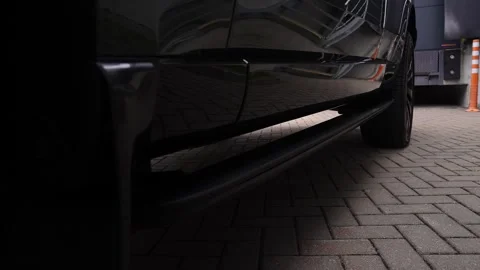 Low angle close up of Range Rover step at loading bay with bollard 動画素材 321341424