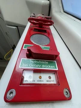 Low angle close up of a red emergency alarm in modern public transoprt Stock Photos
