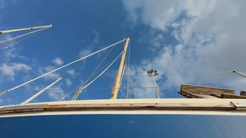 Low angle close up of sailboat mast and rigging under cloudy sky Stock Footage 337048628