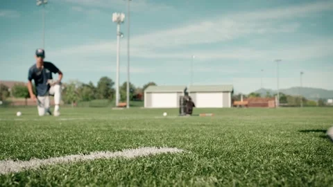 Low angle close up shot of a baseball glove fielding a grounder baseball Stock Footage 231193587