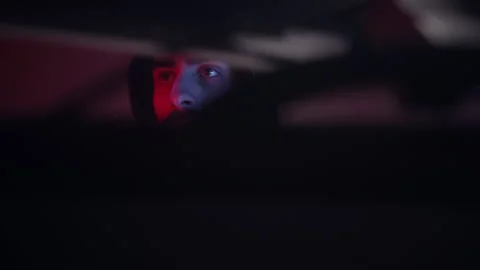 Low angle close-up shot of computer hacker in hoodie, using pc Stock Footage 152481935