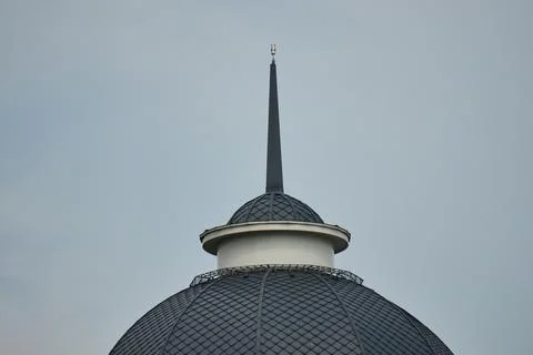 Low angle close up shot of a dark steel building spire and textured tiled d.. Stock Photos