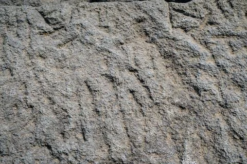 Low angle close-up shot of grey andesite stone block surface texture Stock Photos