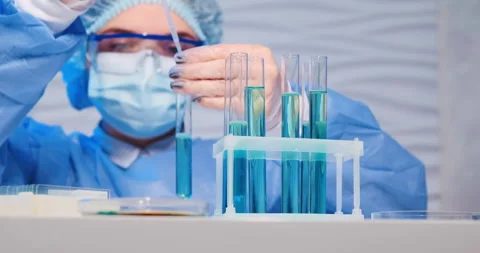 Low angle close-up shot of pharmacy doctor scientist experiment with vaccine 動画素材 152042946