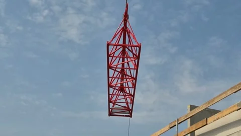 Low Angle Close-up of a Tower Crane Section Being Hoisted Vídeos de archivo 331194610