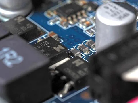 Low-angle close-up of the video card chip showing the Board and capacitors Stock Photos