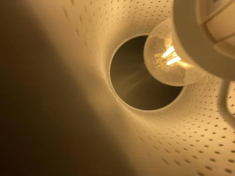 Low angle close up of a vintage lightbulb glowing Stock Photos