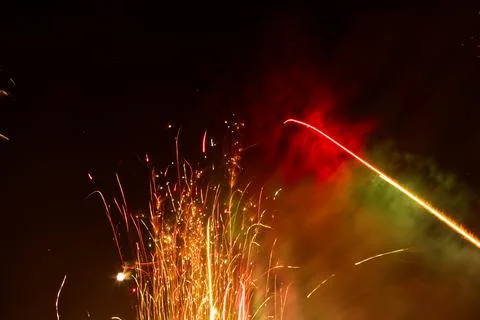 A low angle closeup view of beautiful colorful fireworks exploding in the dar Stock Photos