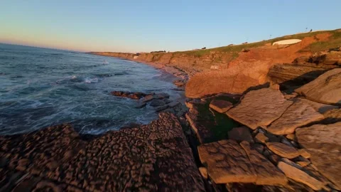 Low-angle coastal scene at sunset Stock Footage 344560567