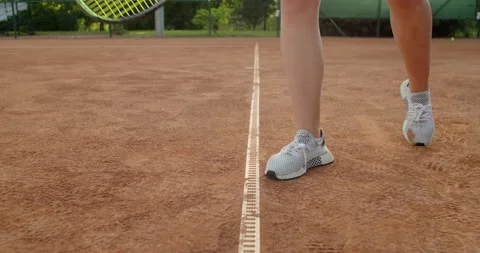 Low angle crop view of sportive female legs jumping while serving ball slow Stock Footage 157747031
