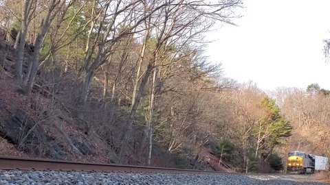 Low angle CSX Freight Train with nat sound audio Stock Footage 147510949