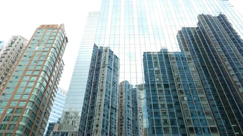 Low angle curtain wall reflection modern apartment building high rise Stock Footage 55690672