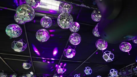 Low Angle, Disco Ball Ceiling Decoration With Violet Pink Lights at Party Venue Видео 332788533