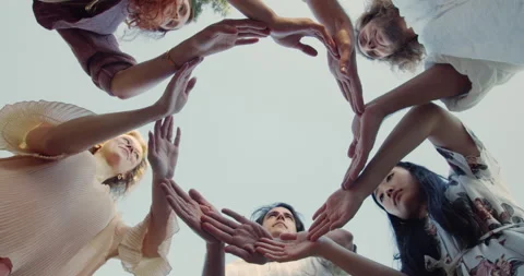 Low angle of diverse young people putting their hands in circle on sky Stock Footage 144818285