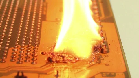 Low angle dolly along burning computer motherboard Stock Footage 76453192