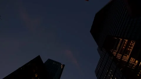 Low angle dolly glide shot of high glassy modern skyscrapers in NYC Stock Footage 145204147