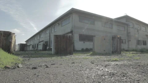 Low angle dolly shot of abandoned building during the day Stock Footage 252293997