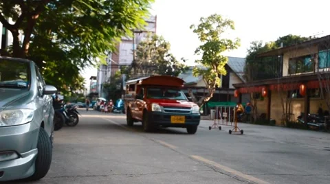 Low angle dolly shot - red truck passing by Stock Footage 55316880