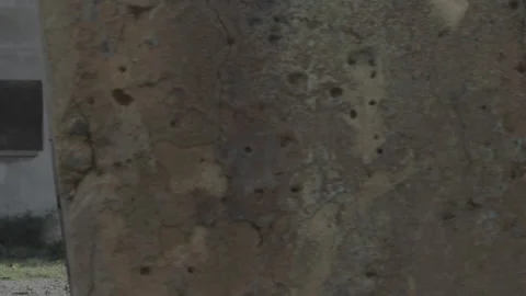 Low angle dolly shot revealing abandoned building, urban exploration Stock Footage 252327003