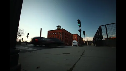 Low Angle Dolly Shot of Small City Corner with Traffis and Pedestrians Stock Footage 127261177