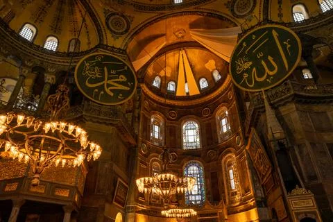 Low angle of dome view of interior of Hagia Sophia mosque with Muslim ornaments Stock Photos