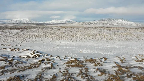 Low angle drone flight over beautiful snow covered pasture, travel in Iceland Video stock 113768226