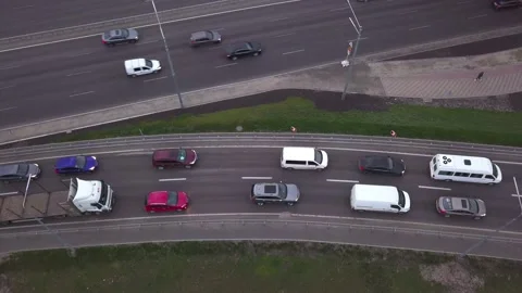 Low-angle drone flight over a massive intersection during early evening rush Stock Footage 155729464