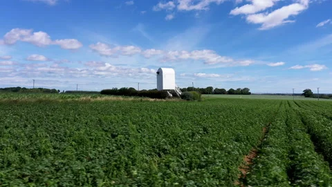 Low angle drone shot circling around a windmill without sails. 4k Stock Footage 147150774
