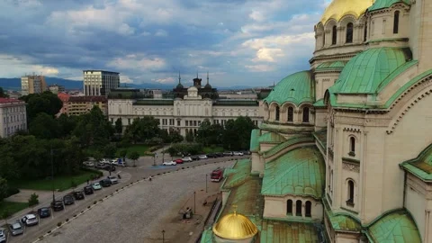 Low angle drone shot framing the golden domes of the Alexander Nevsky Cathedral Stock Footage 339096271