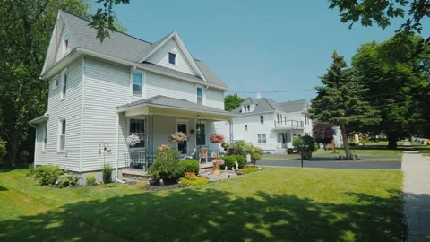 Low angle drone shot of white classic american suburban family home on tree.. Stock Footage 334711973