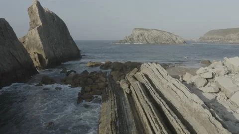 Low angle drone view of cliffs and reefs in Spain 4K Stock Footage 137706620