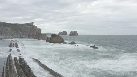 Low angle drone view of reef and waves in Spain 4K Stock Footage 137707150