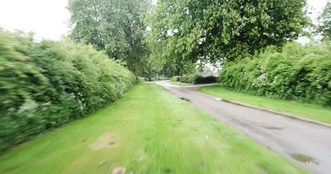 Low angle drone/tracking shot of a motorbike rider in the countryside. 库存影片 242584108