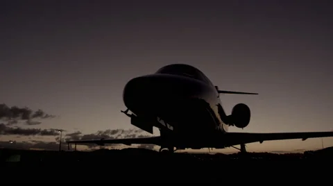 Low angle dusk/night shot of parked private jet (Cessna Citation) Stock Footage 55691791